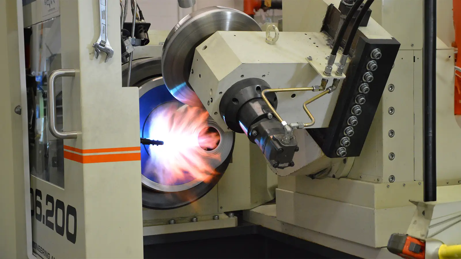 Photo showing the metalworking process with a spin forming machine.