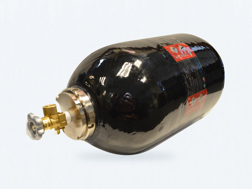 Bastion vessel with its brass valve, machined metal closure, warning labels and Steelhead markings.