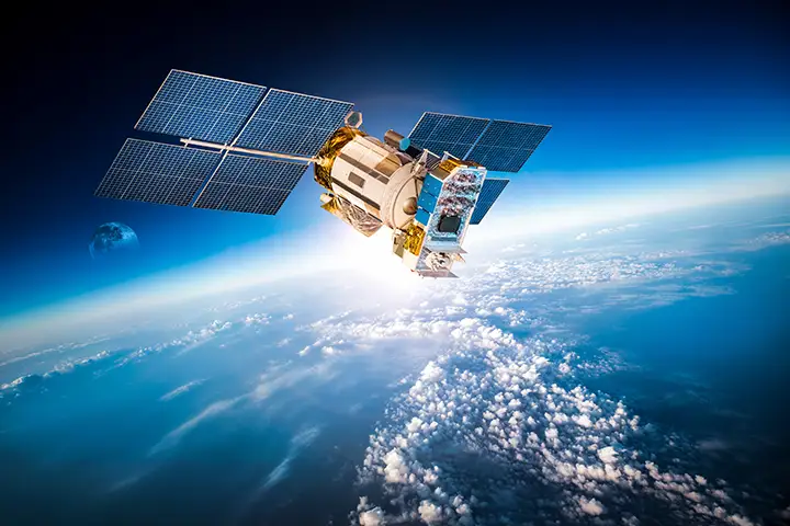 Satellite in orbit representing spacecraft pressure vessel and propulsion tank applications
