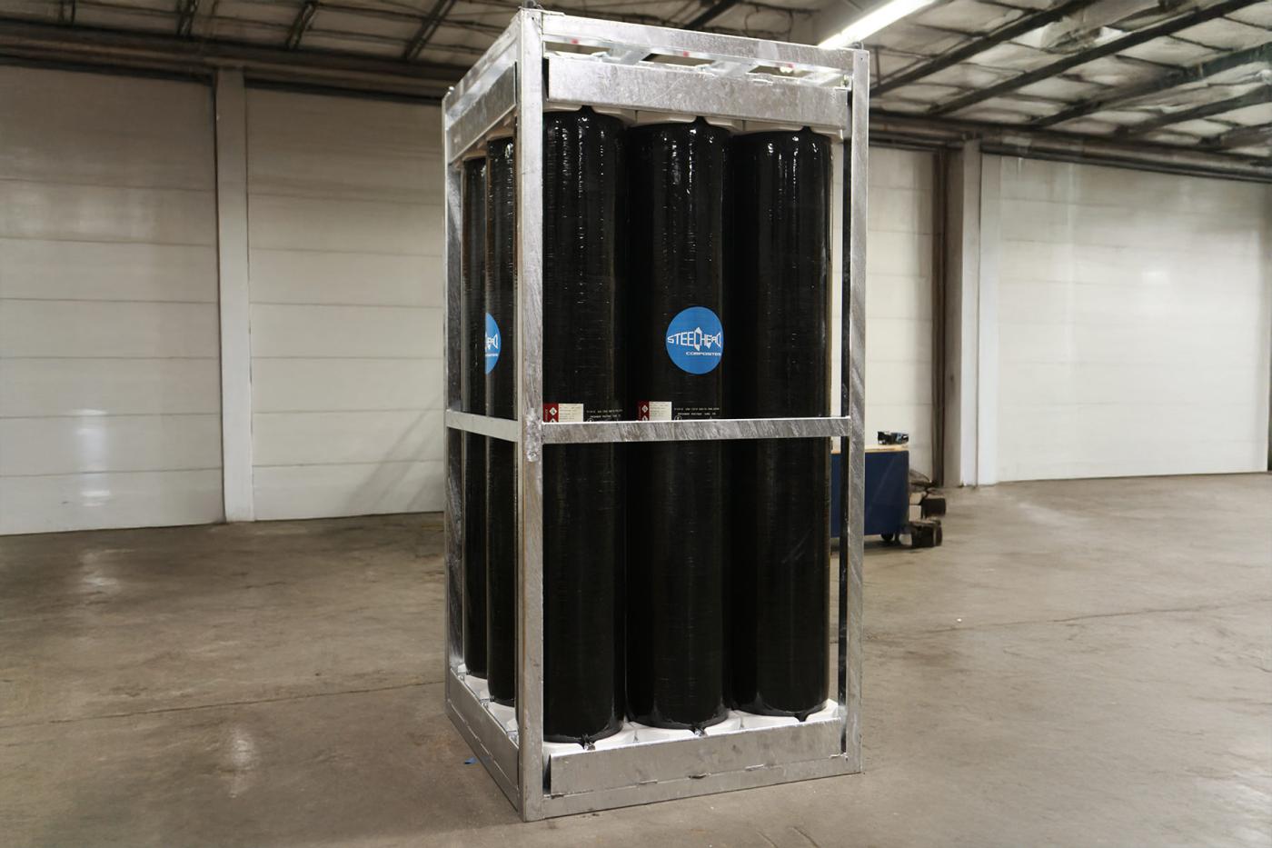 Steelhead skid-mounted composite pressure vessel module featuring multiple vertically oriented COPVs secured within a reinforced steel frame, designed for safe transport and deployment of compressed gases for industrial, energy, and field operations.