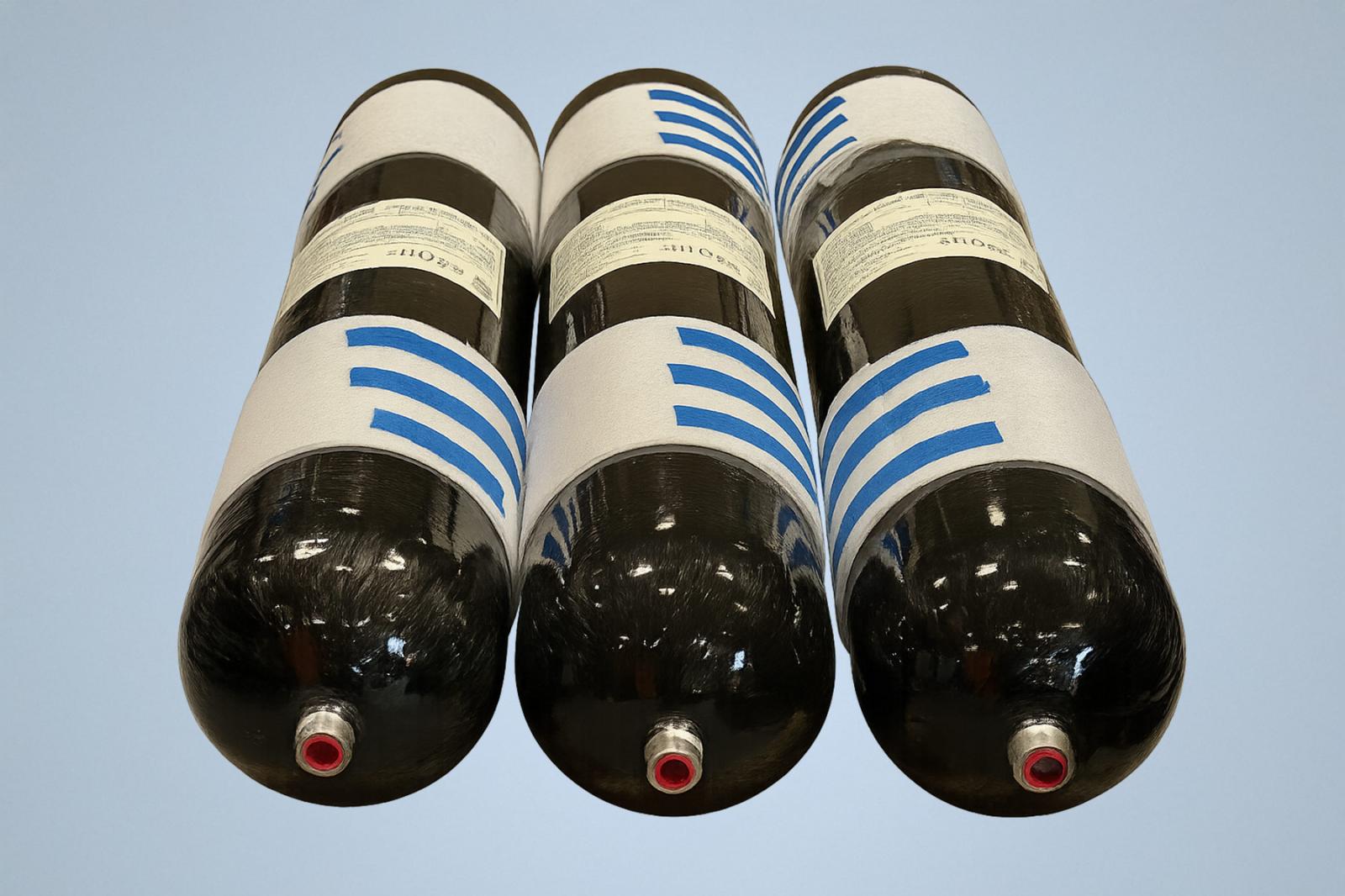 Three black composite Type 3 CNG pressure cylinders with white protective wraps and blue markings, shown isolated on a clean background.